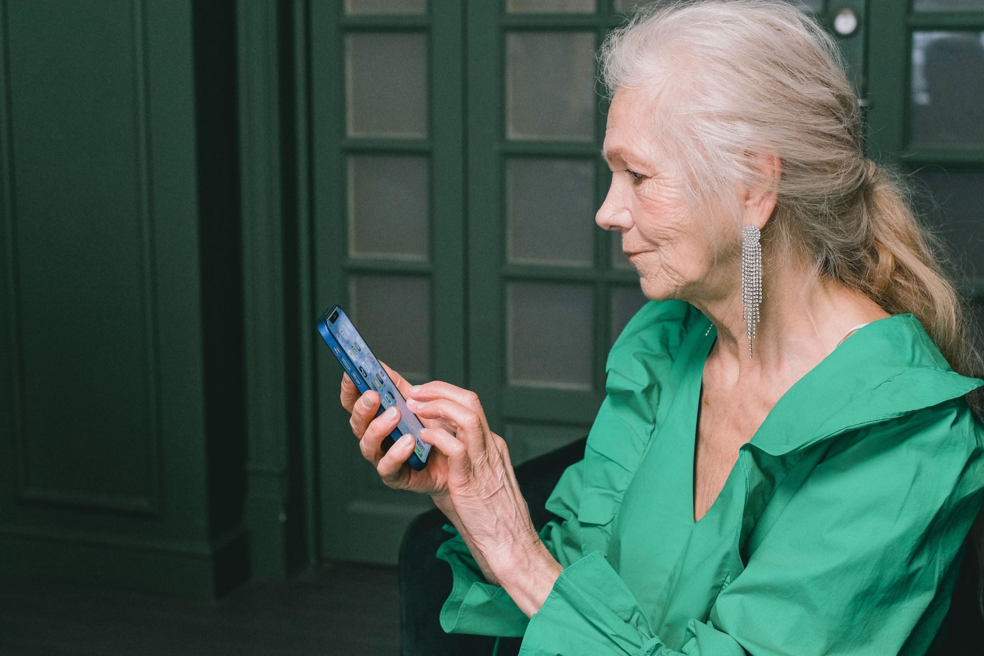 Elderly woman using smart phone