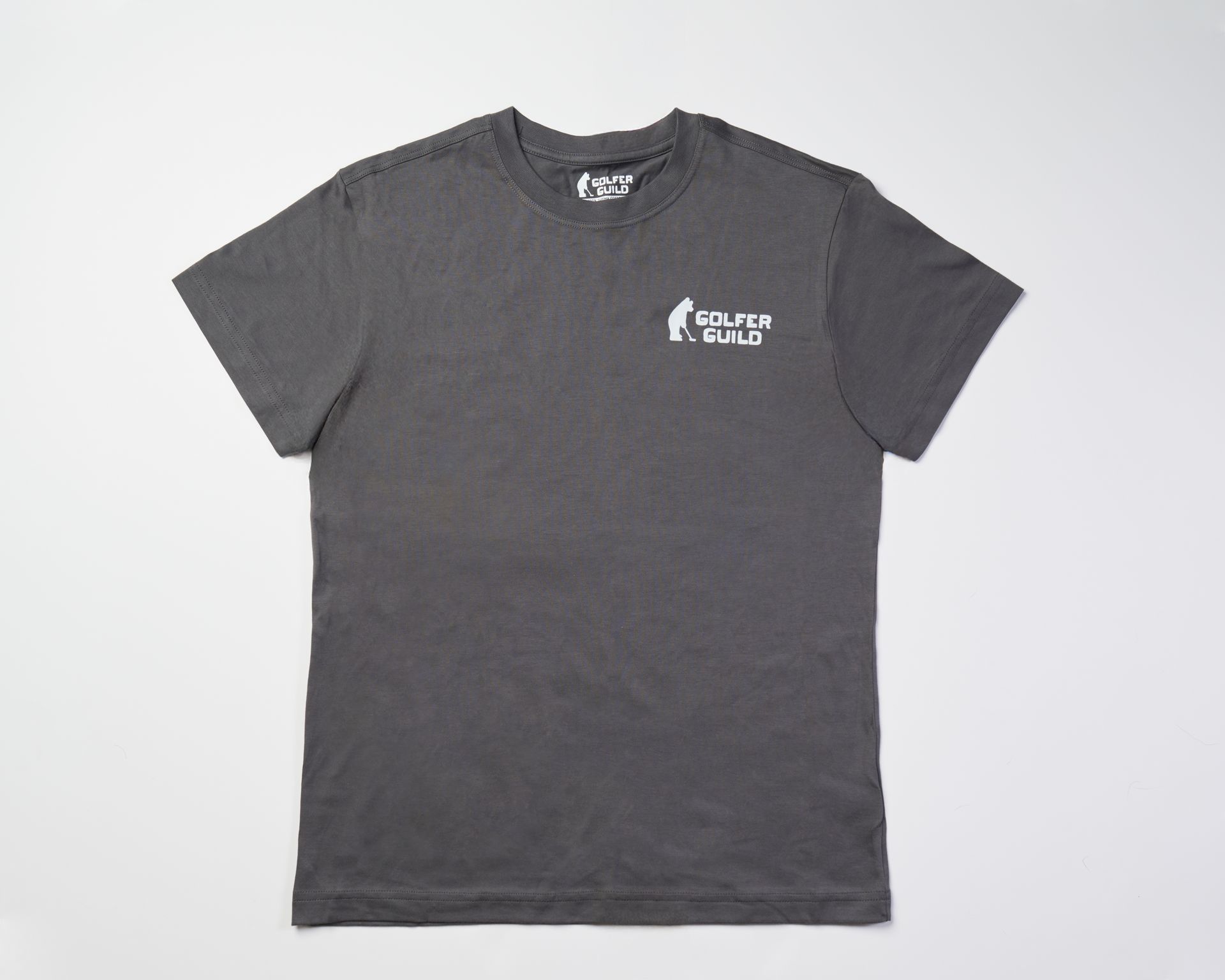 Golfer Guild SUPIMA® cotton Tartan Swinger tee with highland cow golfing animal art by Jonas Claesson.