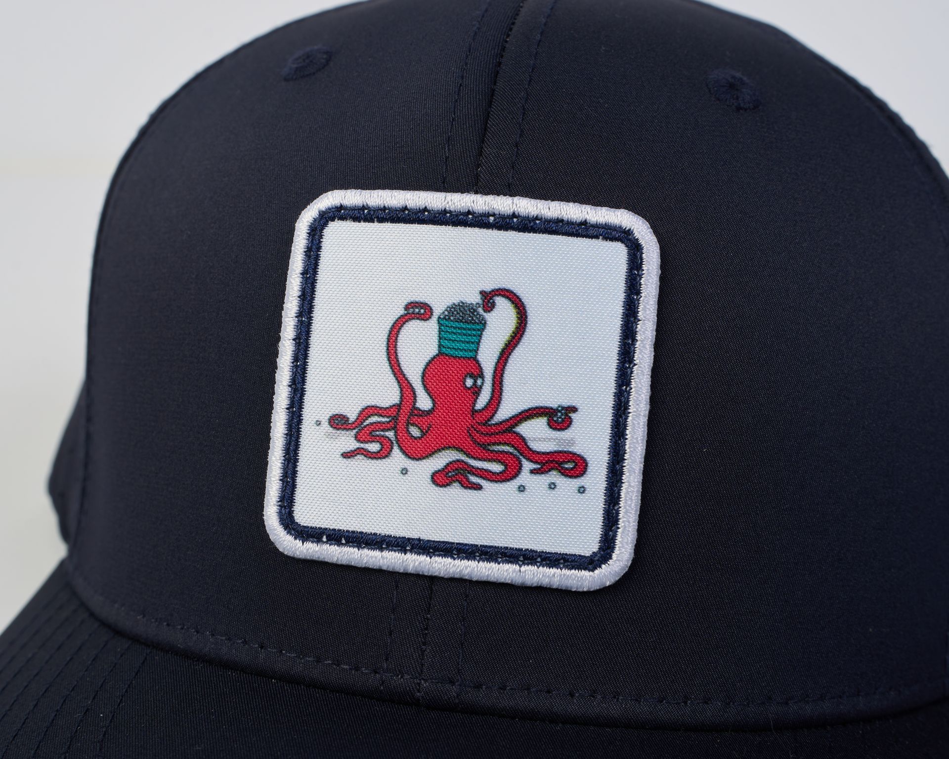 Golfer Guild Kraken Caddie Performance Baseball Hat with golfing animal octopus art by Jonas Claesson