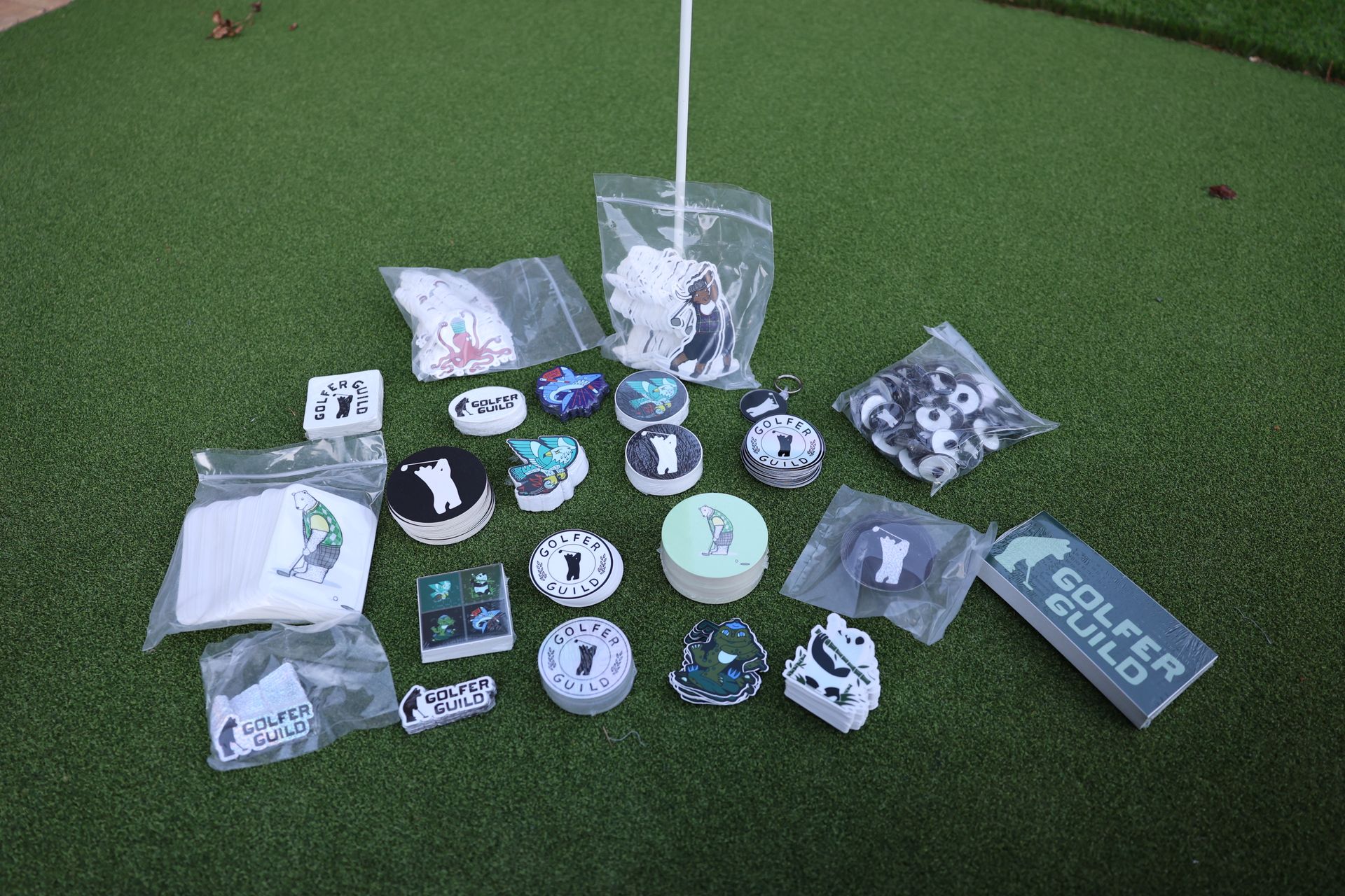 Golfer Guild surprise mystery item — random golf accessory or collectible. Lots of golfing animals