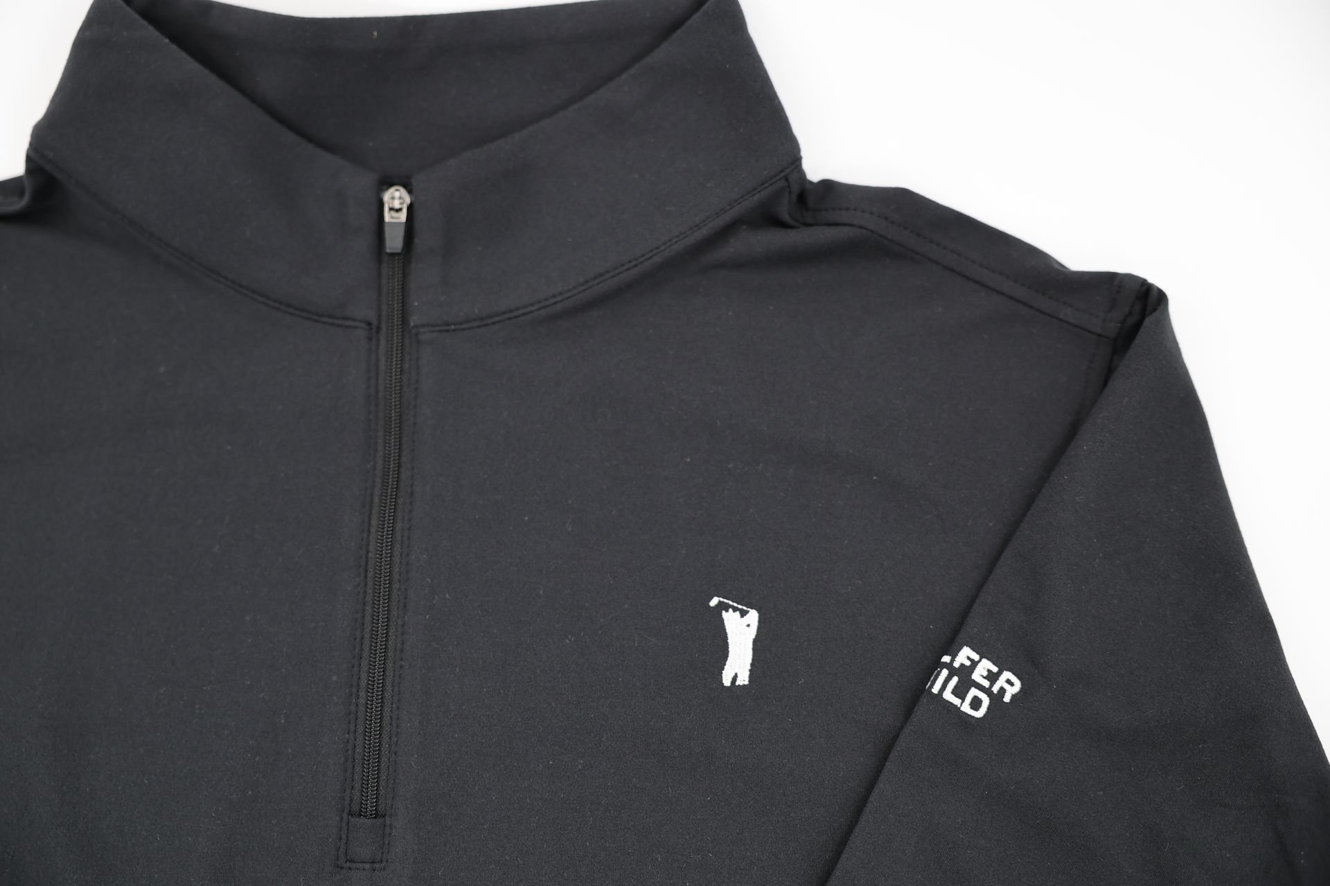 Female model in black coziest quarter zip in golf