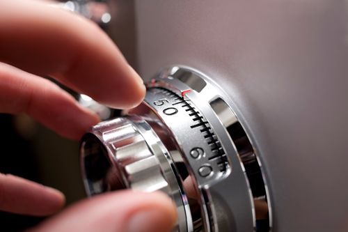 A Person Is Opening A Safe With A Combination Lock - Bolingbrook, IL - Master Locksmithing Inc