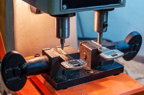 A Machine Is Cutting A Key On A Table - Bolingbrook, IL - Master Locksmithing Inc