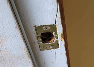 A Man Is Trying To Open A Car Door With A Key - Bolingbrook, IL - Master Locksmithing Inc