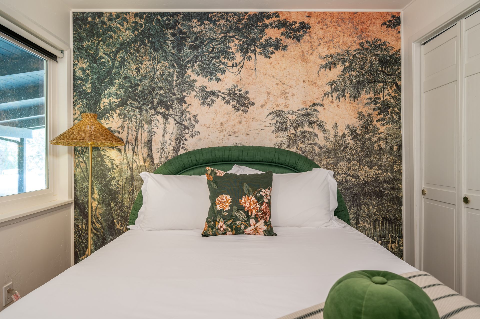 Sierra Skyline Jungle Oasis bedroom with tropical botanical wallpaper and queen bed