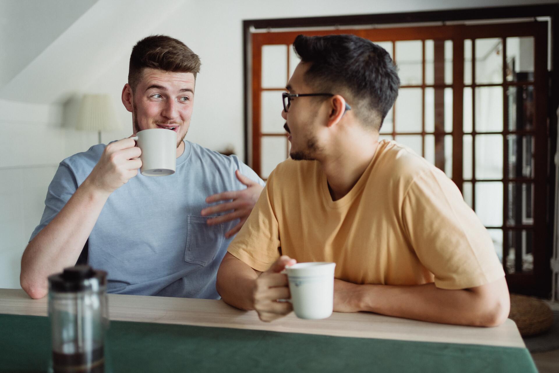 A same-sex couple snuggle and are happy to be together
