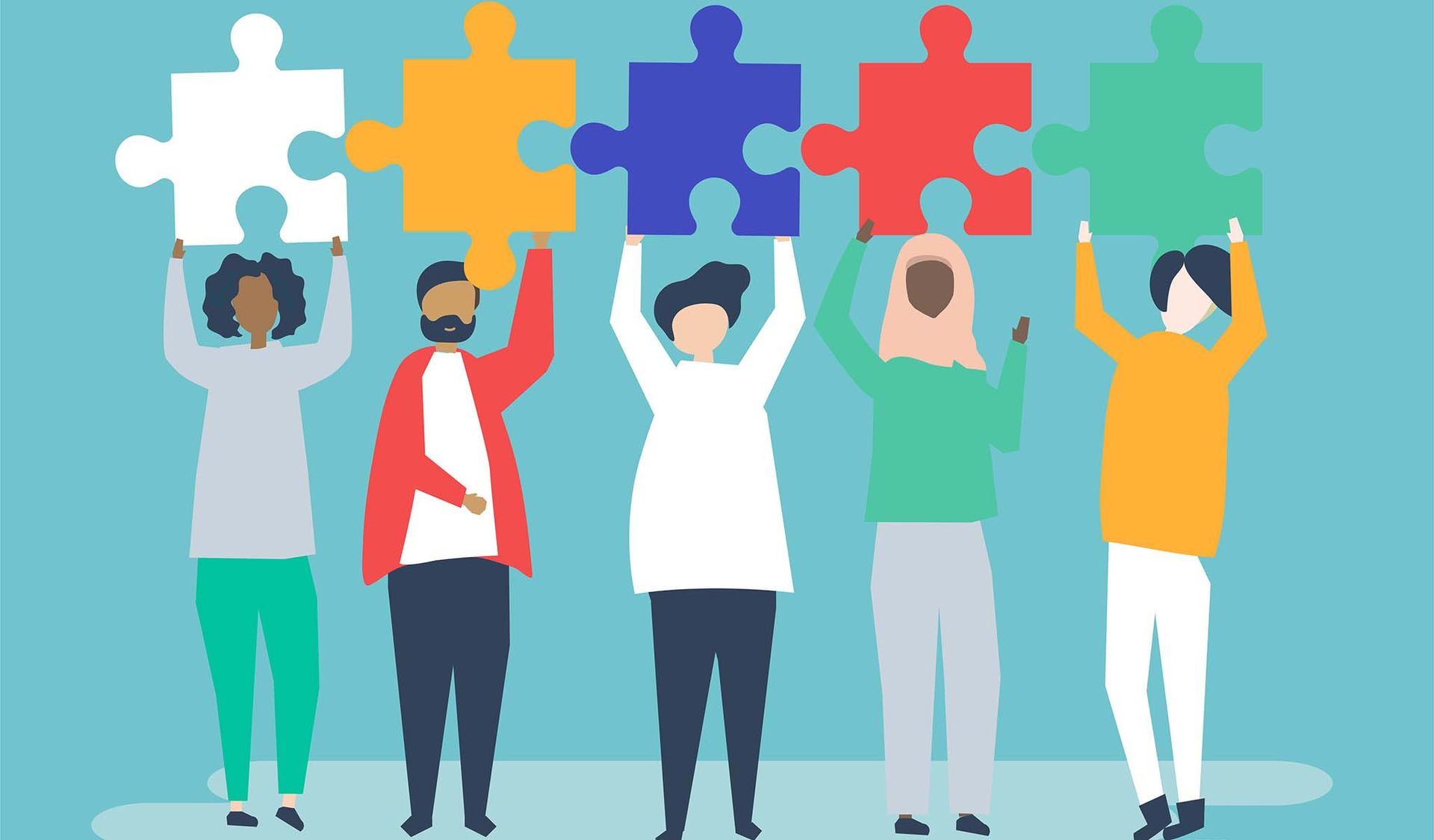 a group of people are holding up puzzle pieces in their hands .