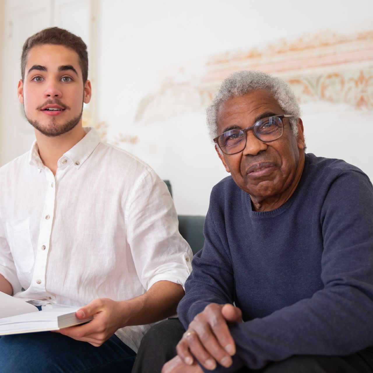 a man and an older man are sitting next to each other