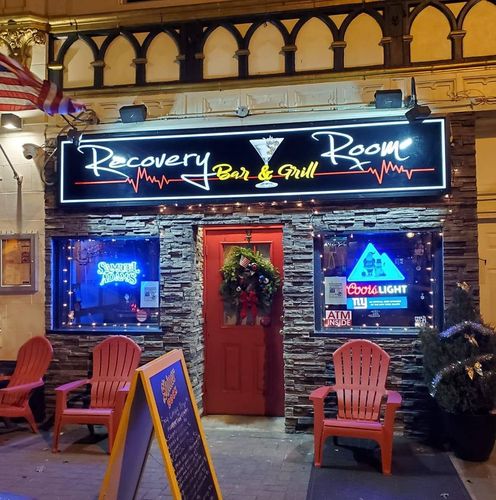 The recovery room bar and grill has a red door