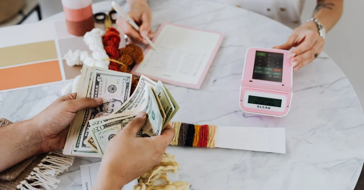 Couple planning out financial budget and counting money.