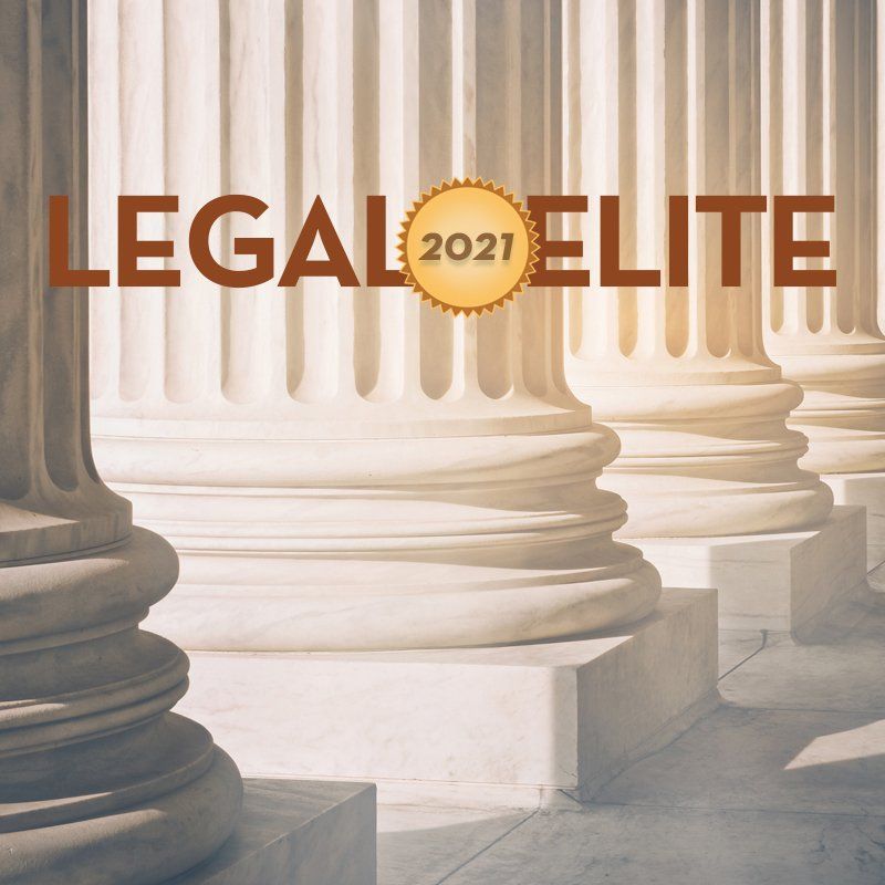 a poster for legal elite with columns in the background