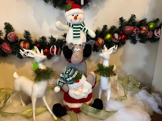 A group of christmas decorations including santa claus and reindeer