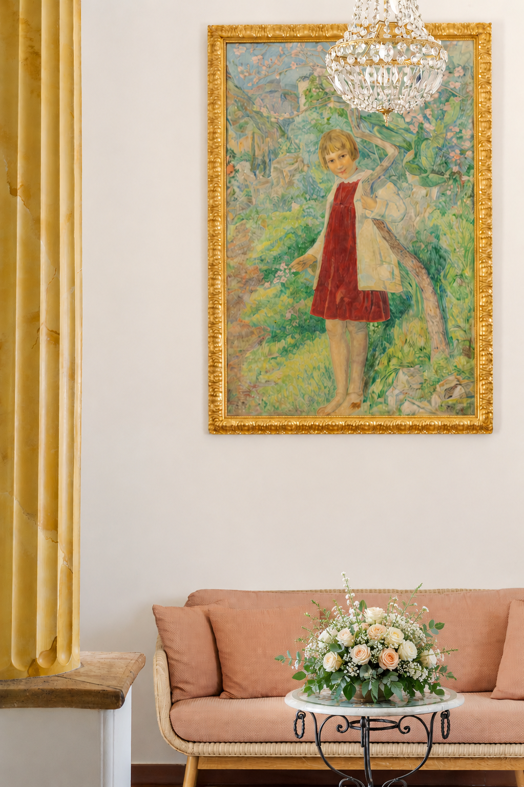 Elegant living room with gold-framed artwork above a pink sofa and floral centerpiece on a table
