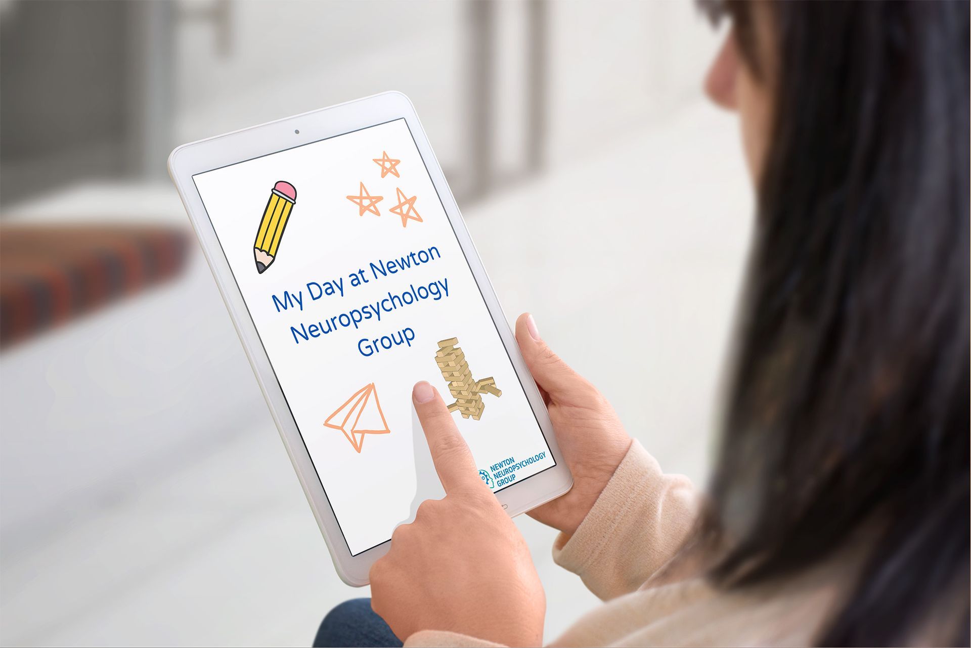 Woman holding a tablet with a colorful