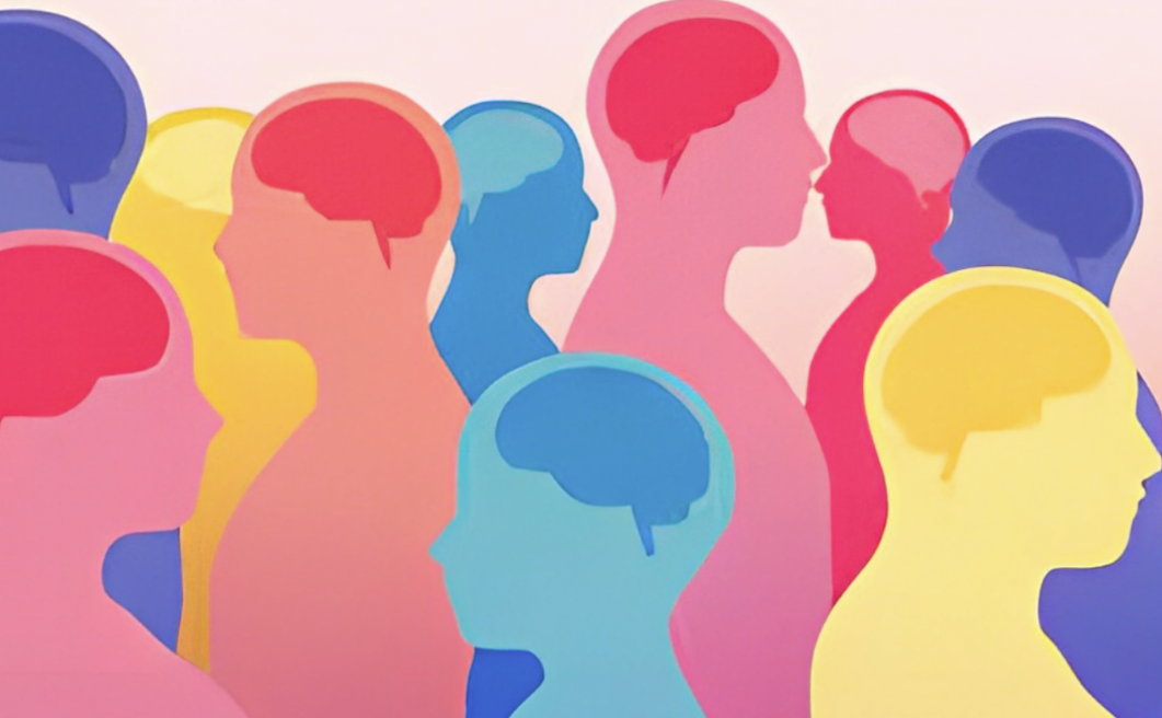 Silhouettes of colorful heads with visible brains, suggesting diverse minds or perspectives.