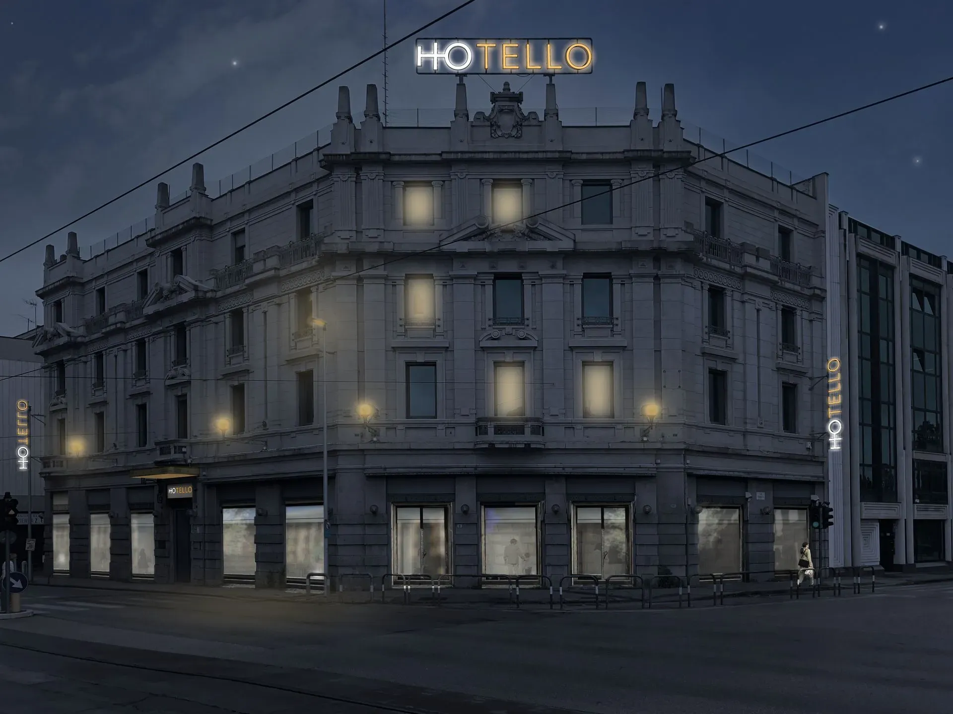 Esterno notturno di Hotello, con insegna e finestre illuminate. Stelle e lampioni illuminano l'edificio.