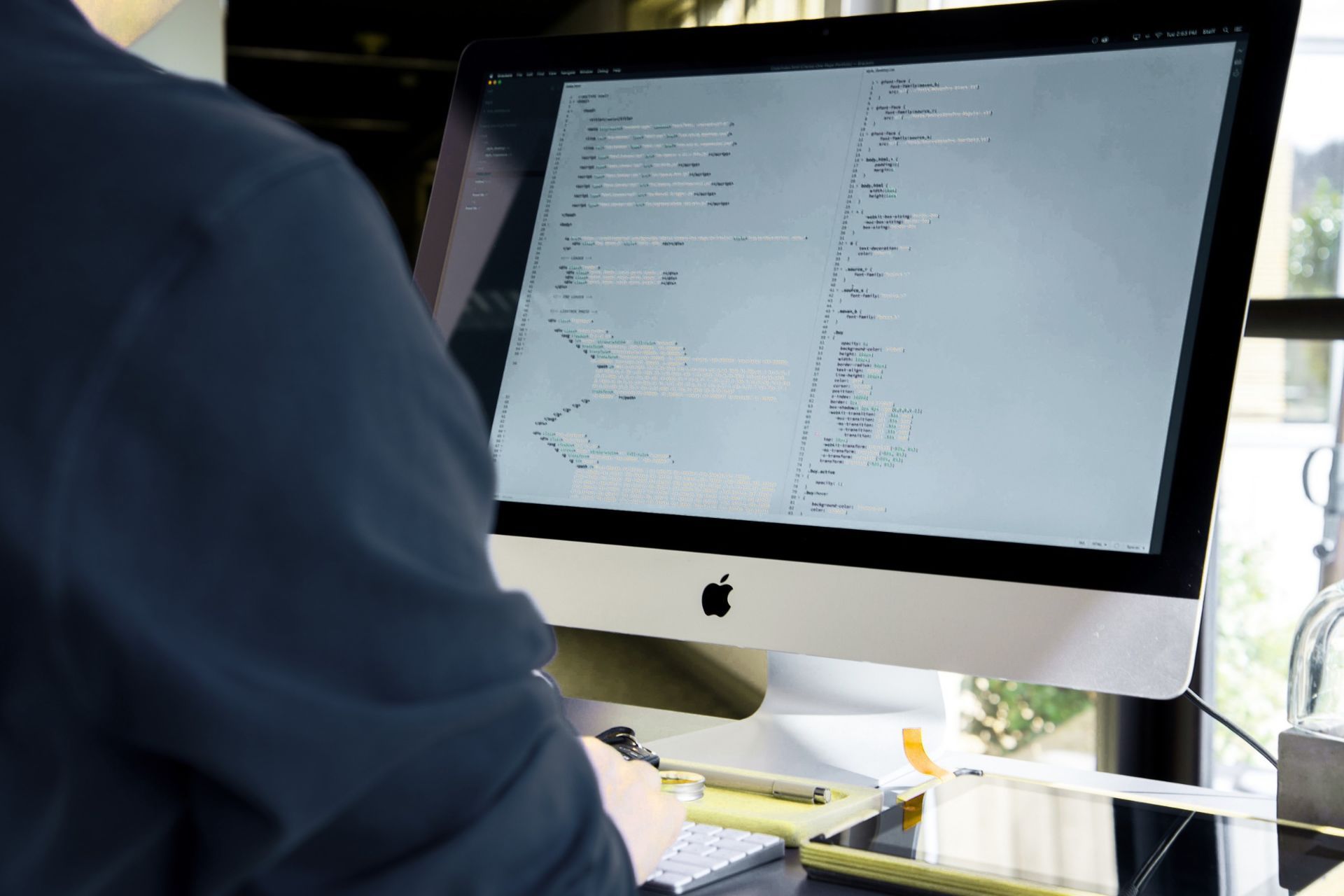 Close-up of a computer screen displaying code. A menu with AI actions is open, including