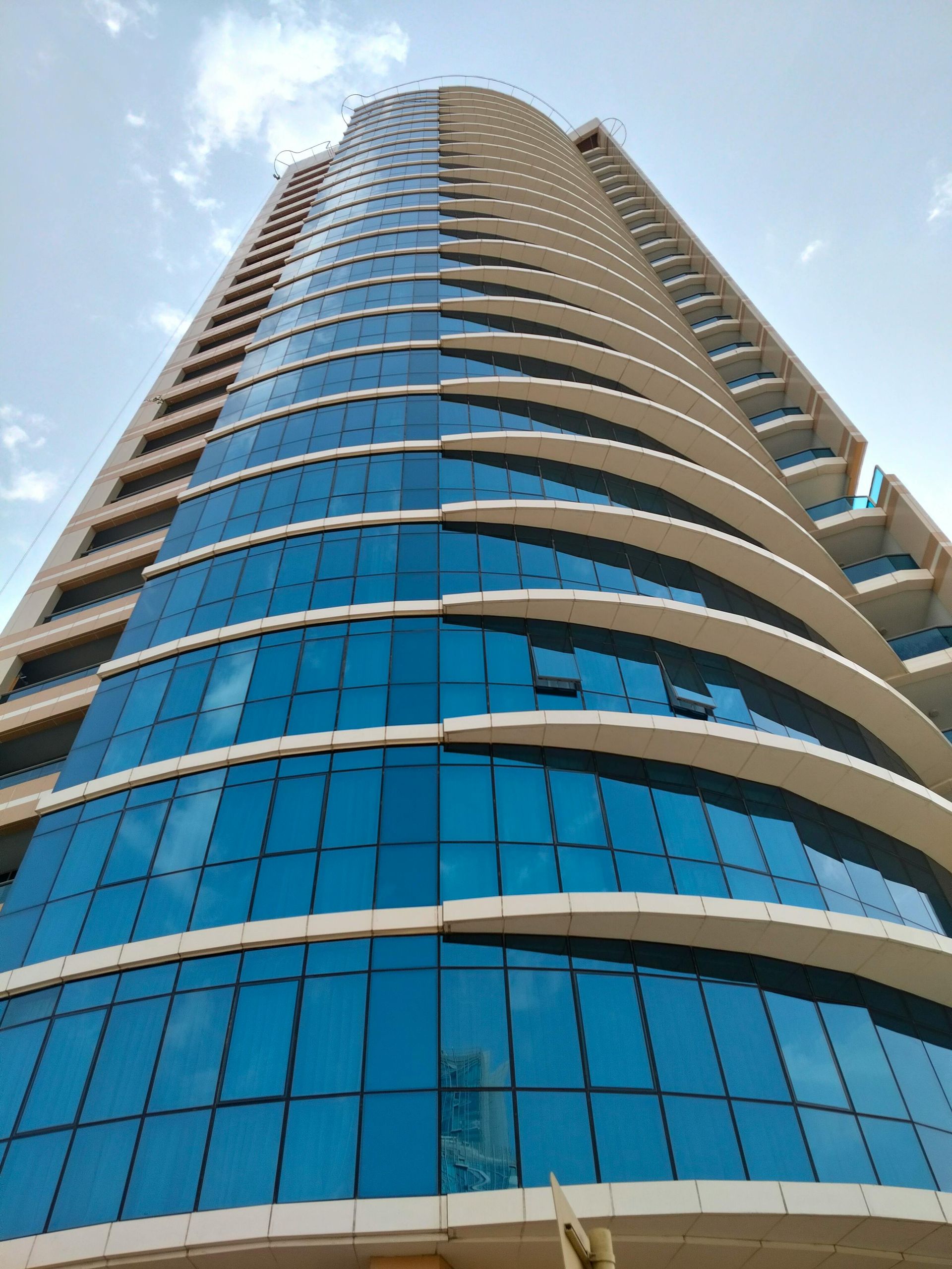 Looking up at a tall building with a lot of windows