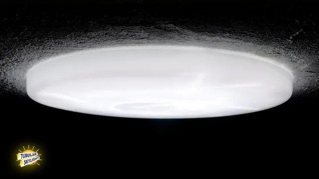 A white circle is glowing in the dark on a black background.