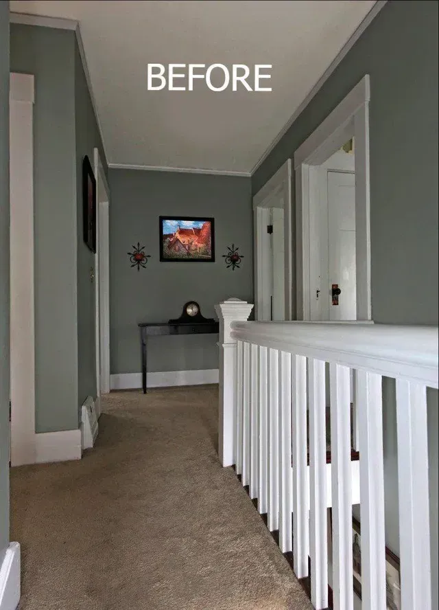 A before picture of a hallway with a white railing.