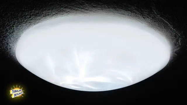 A white light is shining on a black surface.