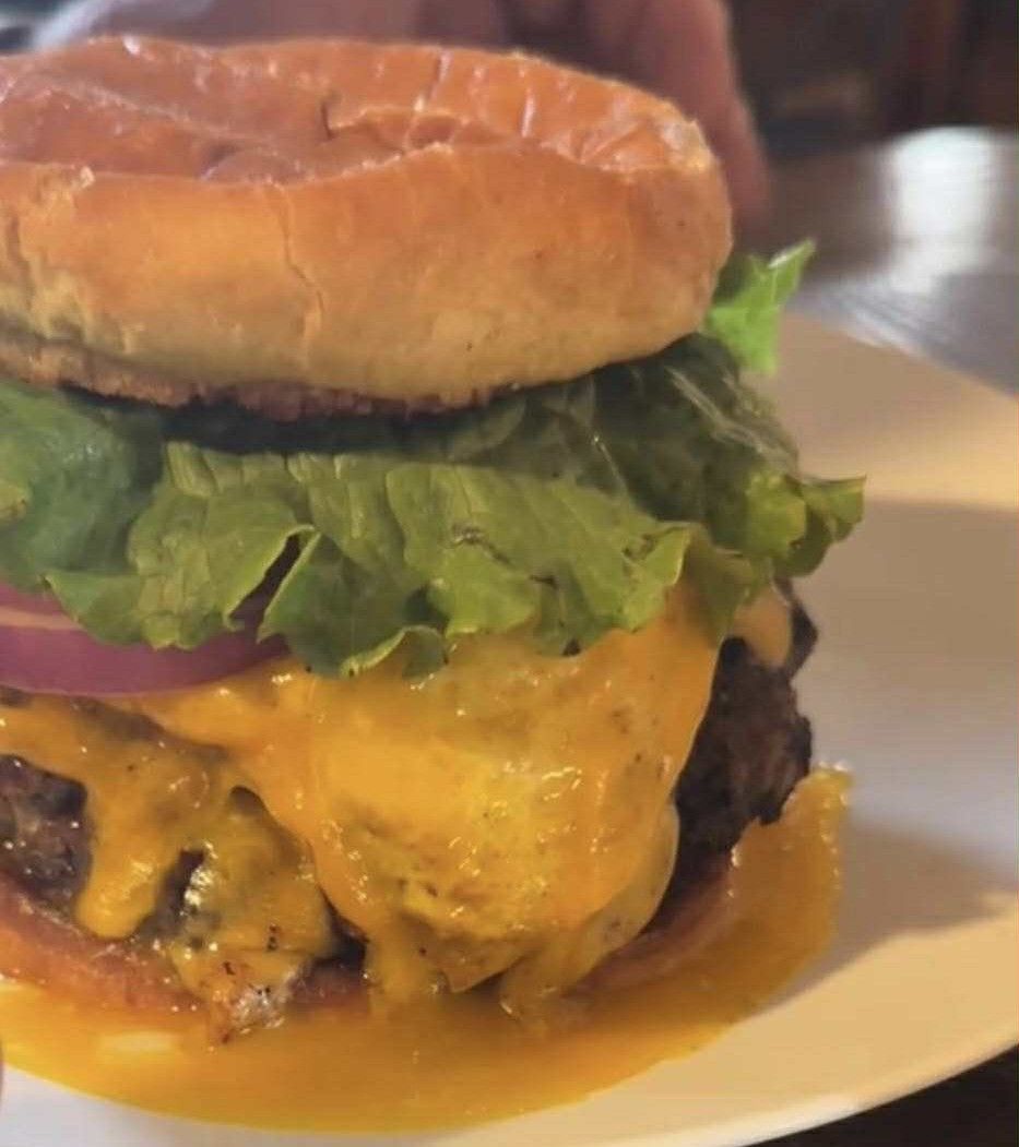 Legends Bar & Grill Andy's burger hamburger lettuce onion egg cheese bun