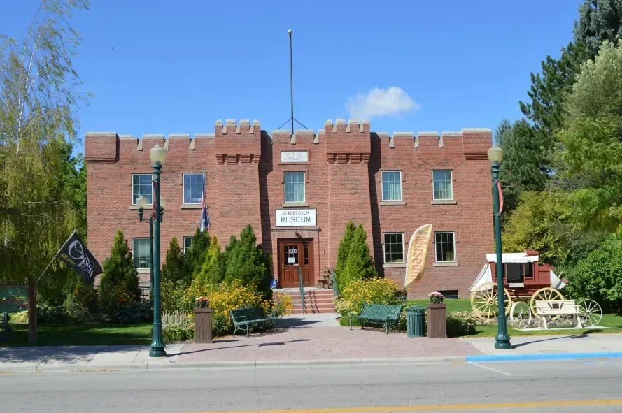 A large brick building with a flag on top of it