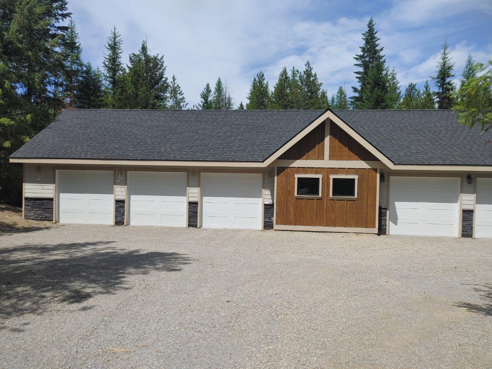 A large house with a lot of garage doors