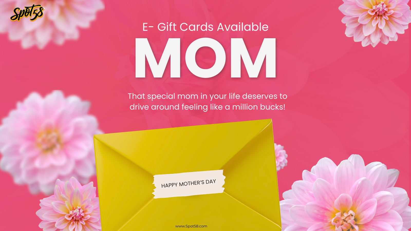 A yellow envelope with the word mom on it is surrounded by pink flowers.
