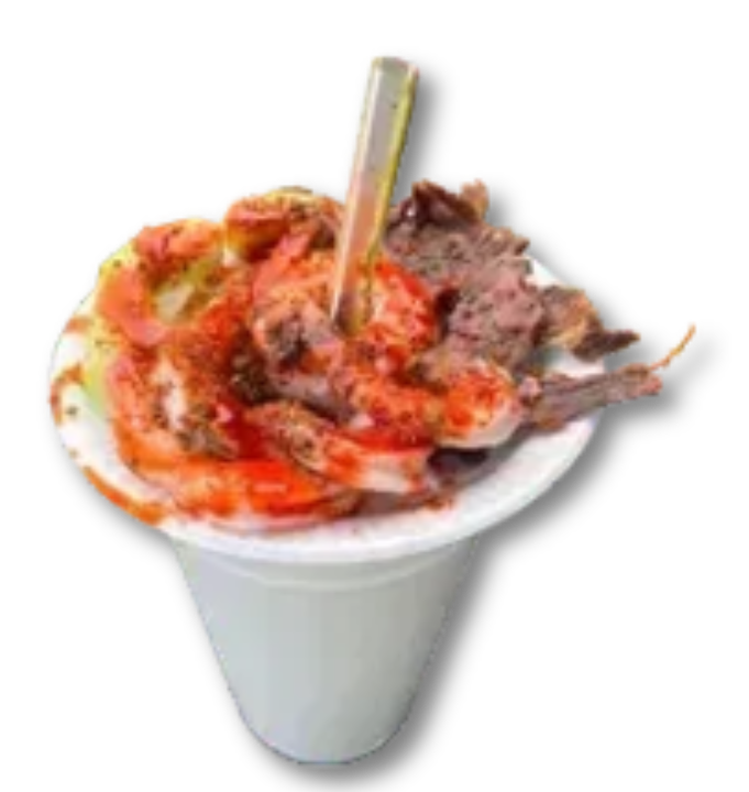A cup of food with a spoon in it