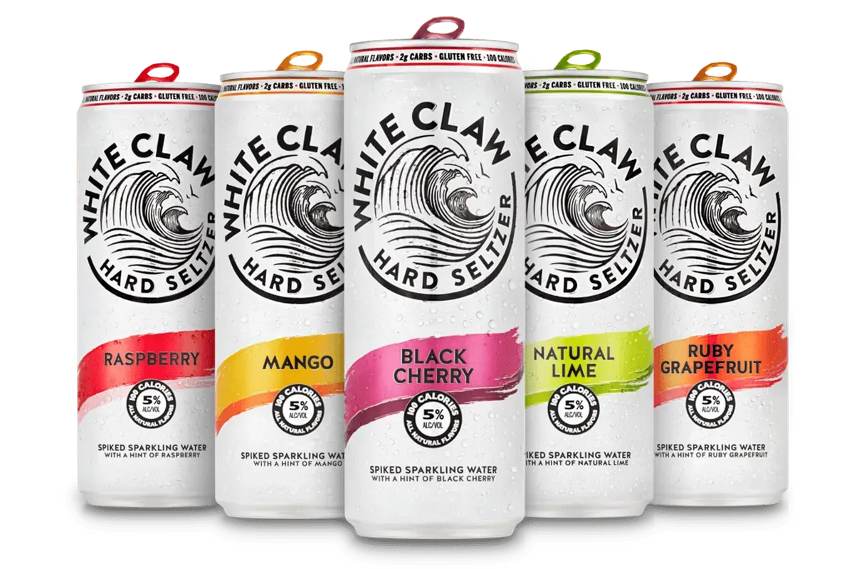 A group of cans of white claw hard seltzer in different flavors.