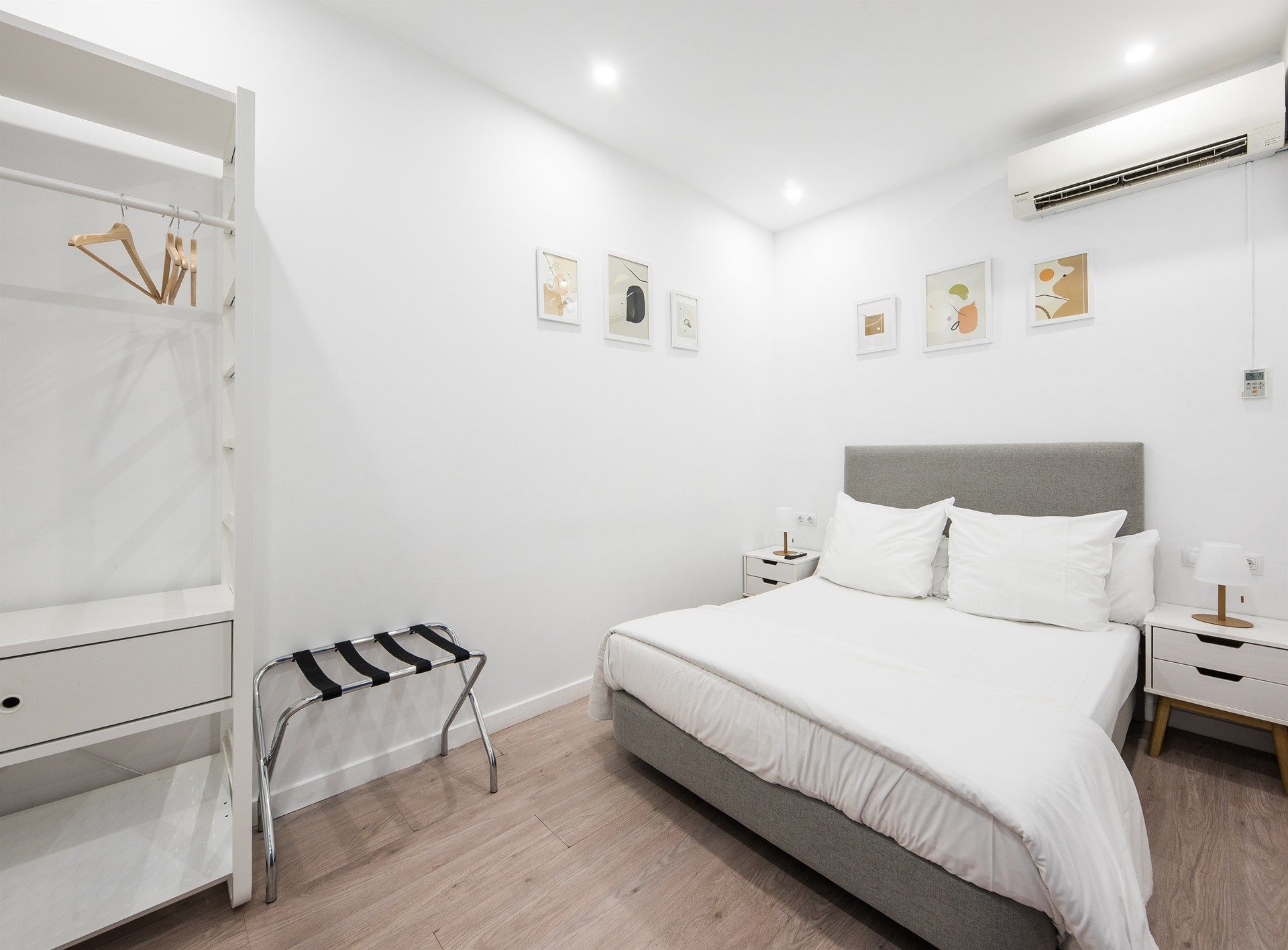 A bedroom with a king size bed , nightstand , and closet.