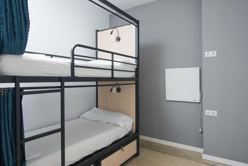 There is a bunk bed in the middle of the room.