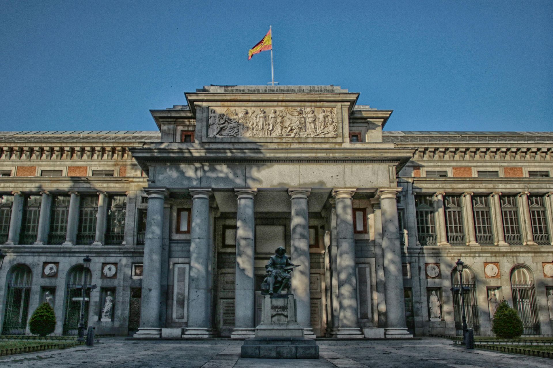 A large building with a flag on top of it