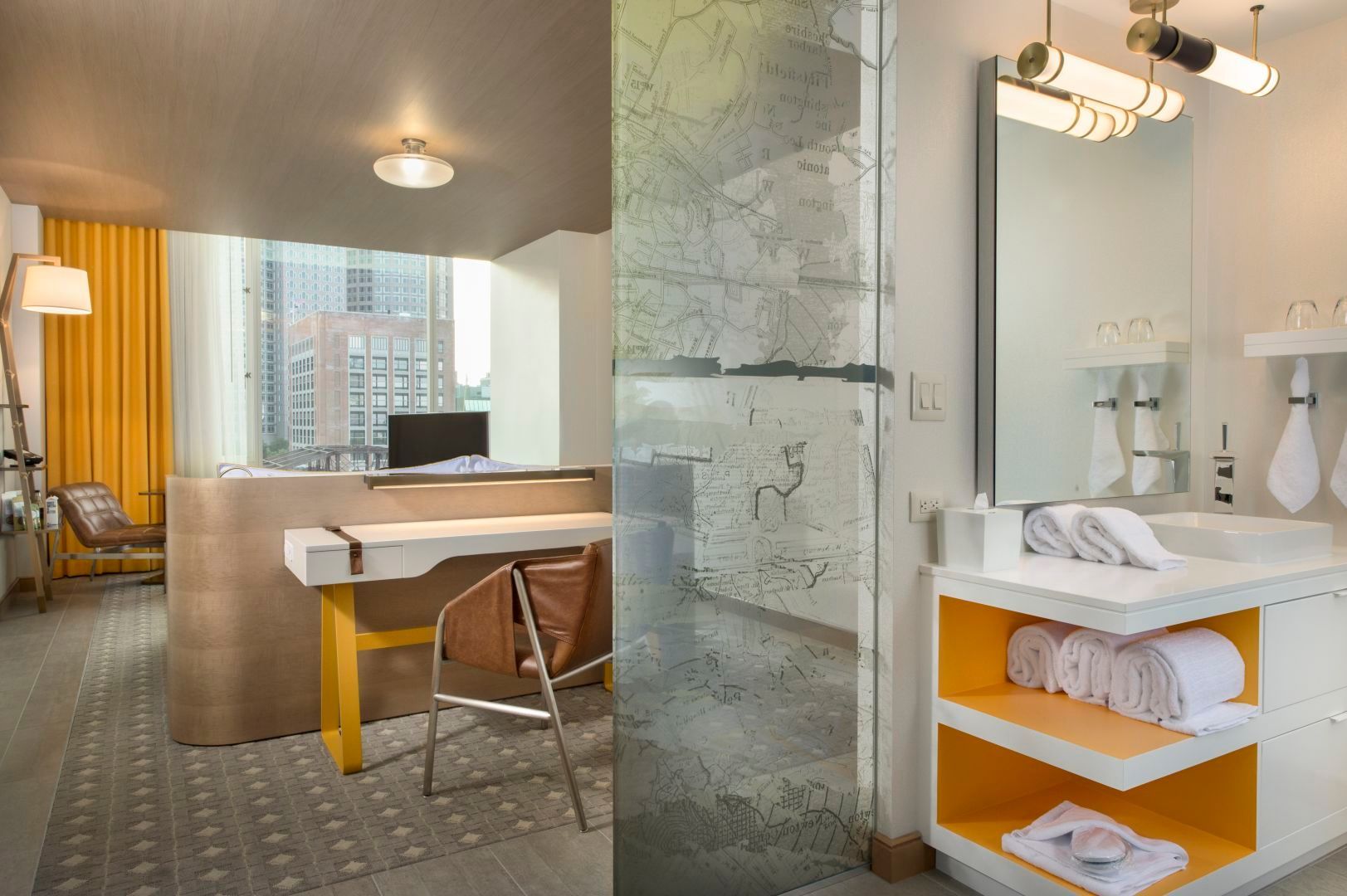 Hotel room interior with a desk, bathroom, and yellow accents.