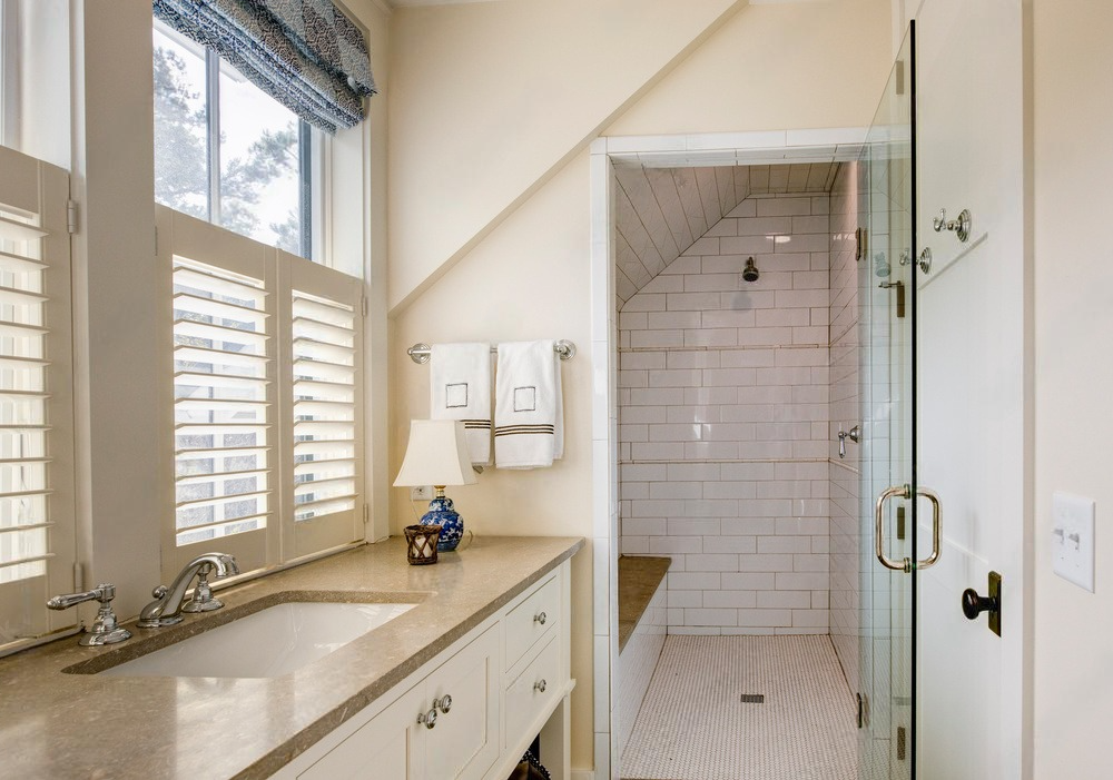a bathroom with a sink and a walk in shower
