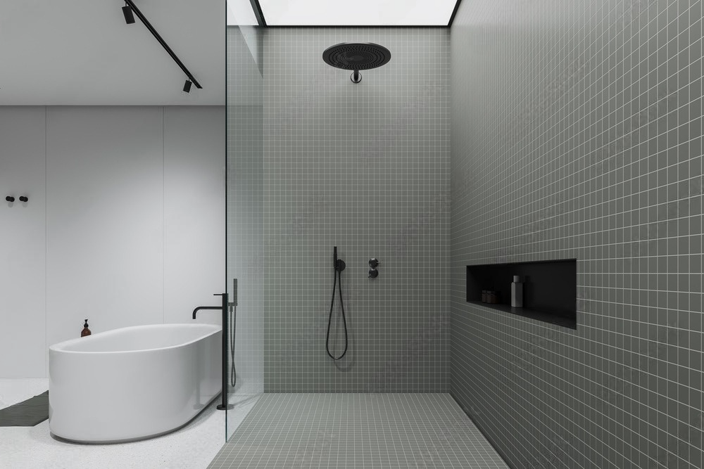 a bathroom with a bathtub and a walk in shower .