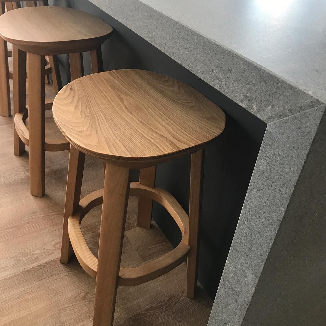 Two Wooden Stools Are Sitting Next To A Counter — Southeast Stone Pty Ltd In Brisbane, QLD