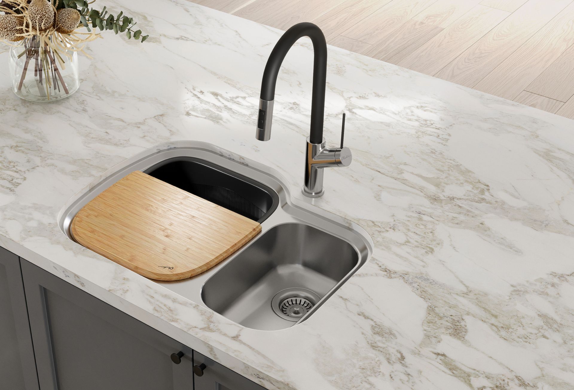Kitchen sink with black faucet, stainless basin, and wooden cutting board insert on white marble countertop — Southeast Stone Pty Ltd In Caloundra West, QLD
