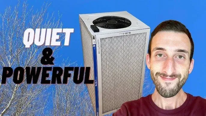 Quiet & powerful text beside a small silver air conditioner and smiling man on blue background