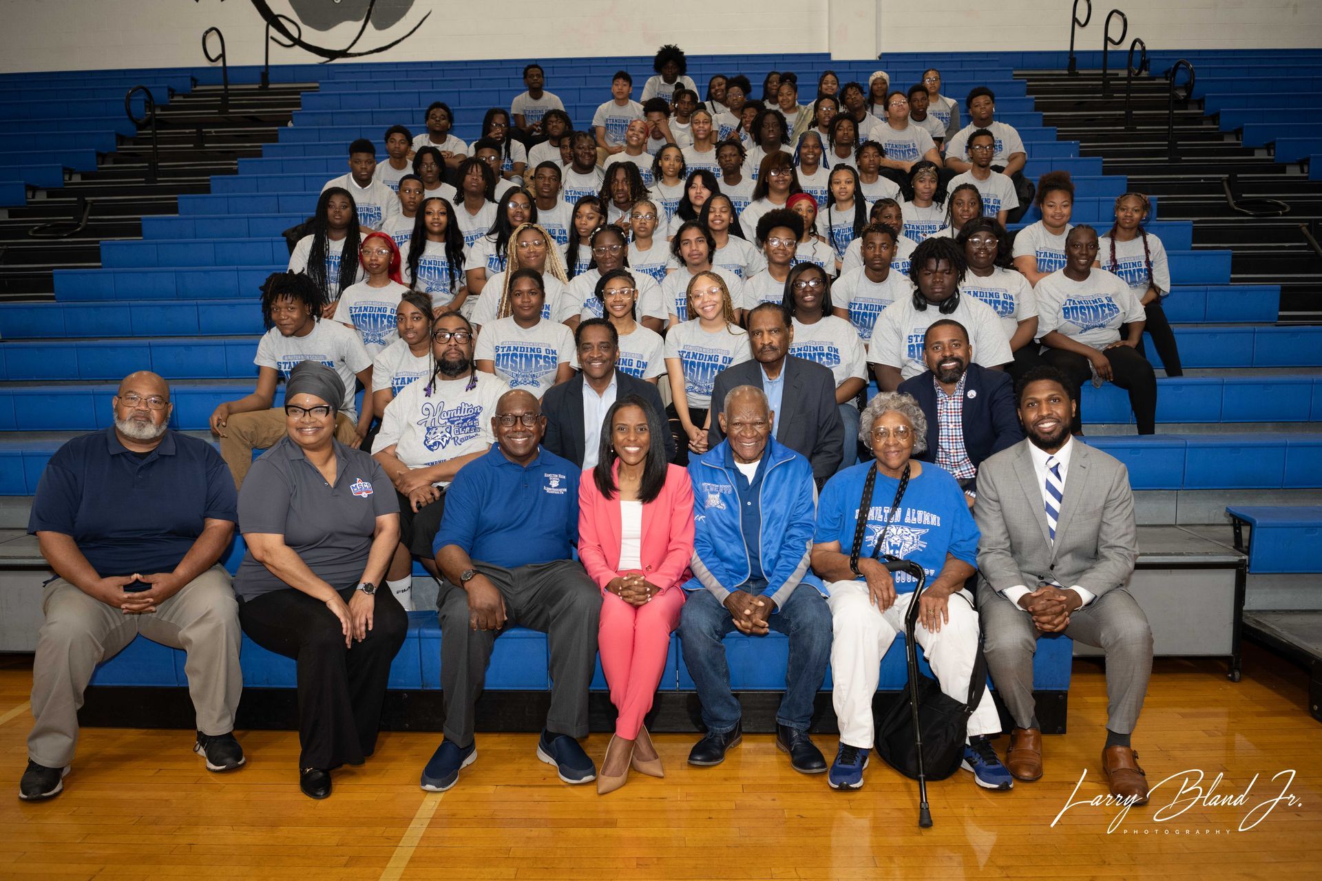 Group portrait in a gym with people 