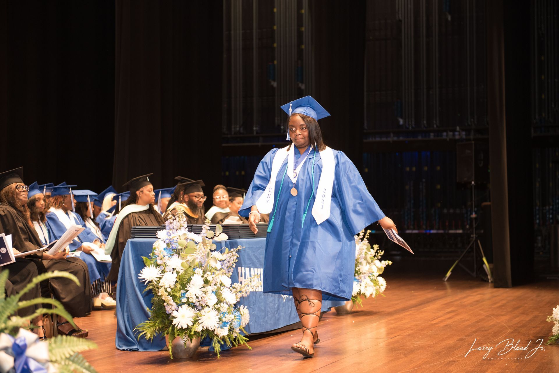 A graduate in blue gown 