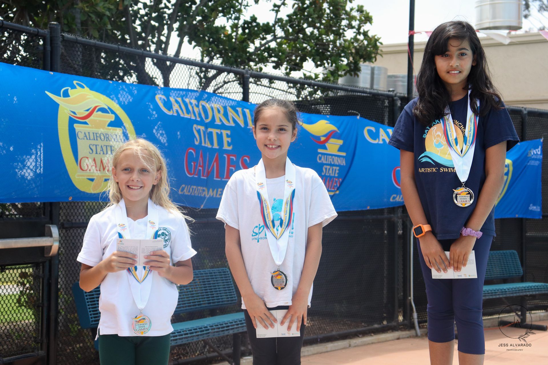 Girls receiving awards for artistic swimming