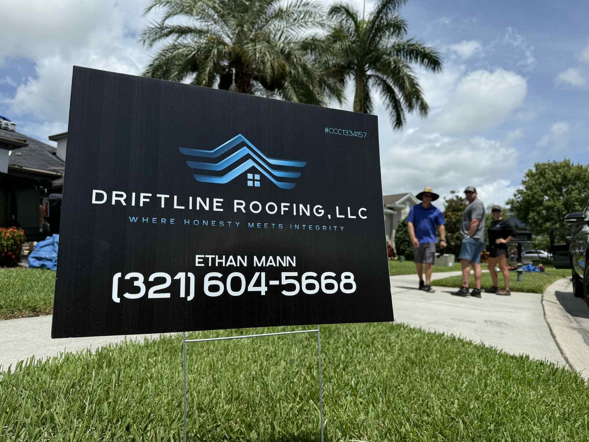 Driftline Roofing team with a homeowner after a completed roofing project