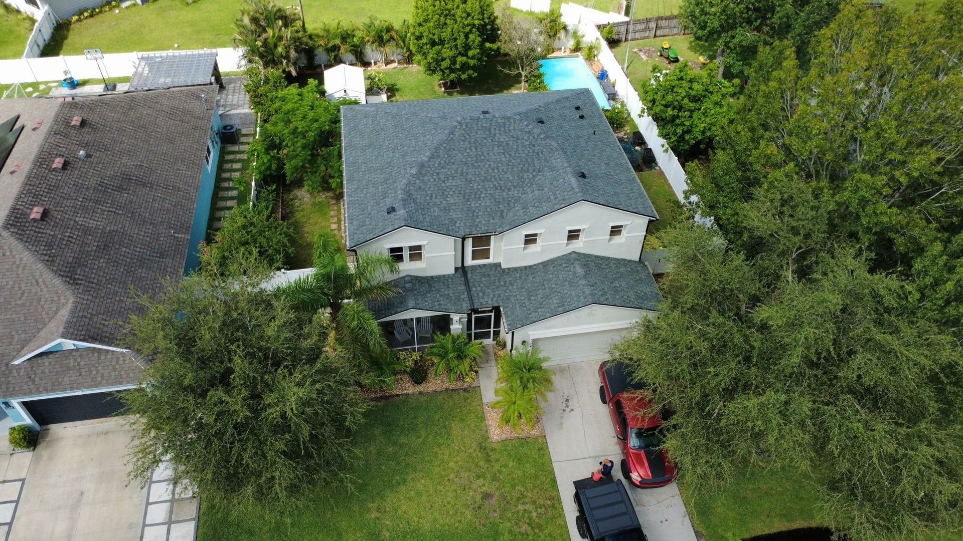 Aerial view of an asphalt shingle roof replacement in Florida
