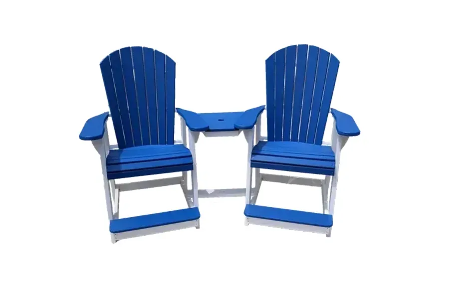 Two blue Adirondack chairs with a small matching table between them