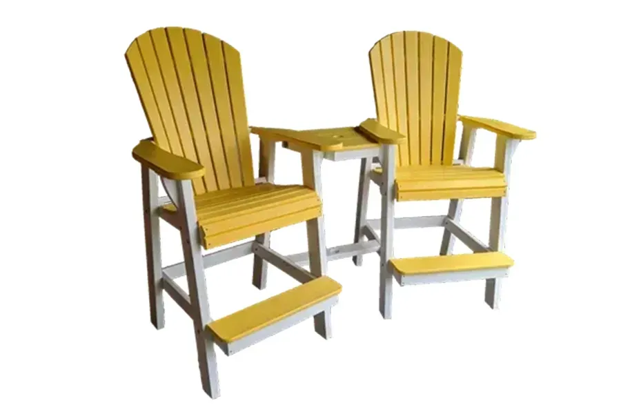 Two yellow wooden chairs with silver frames and built-in footrests, angled side by side on a white background