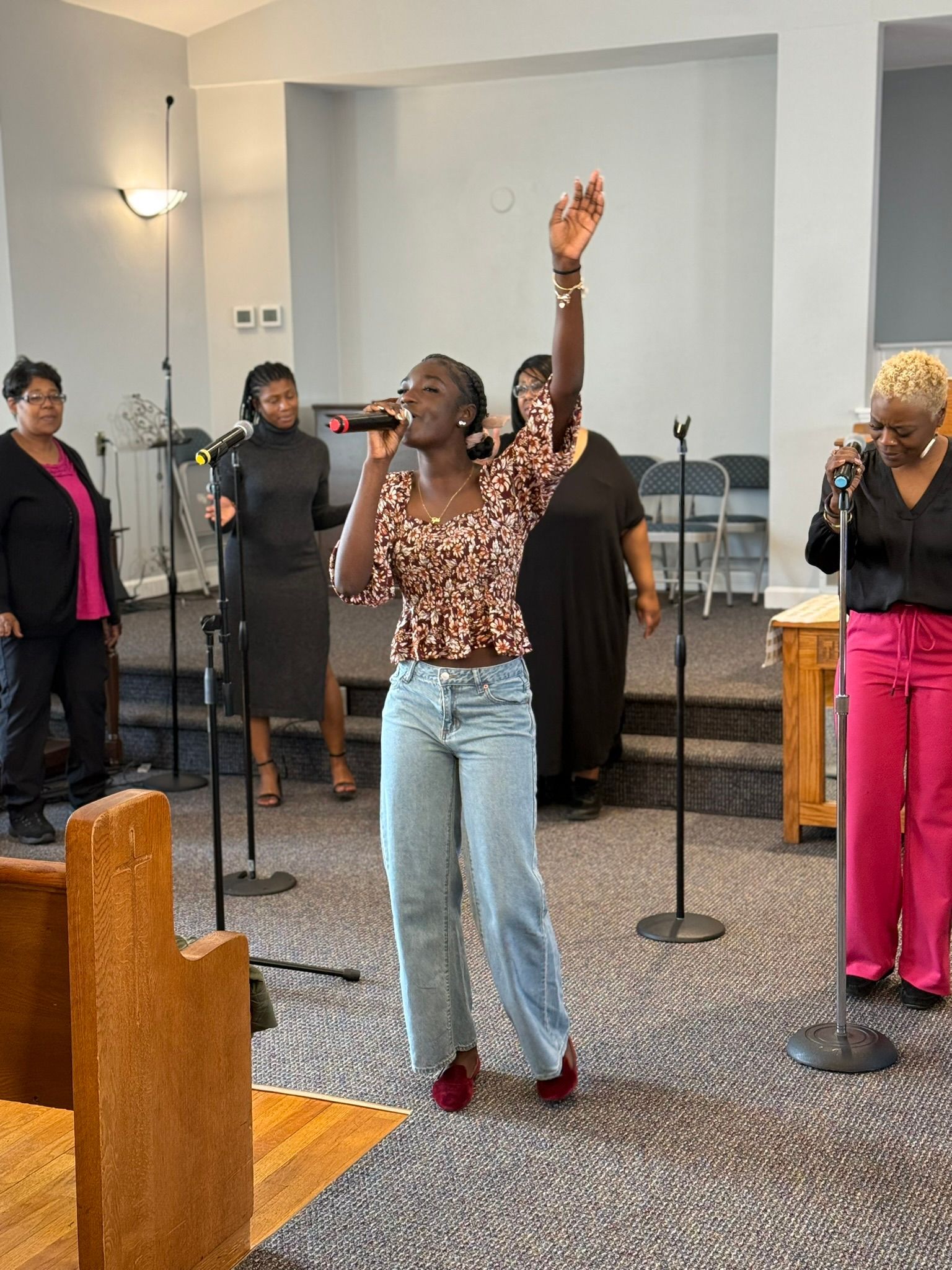 Young person singing in worship.