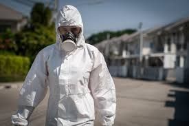 Fort Myers restoration contractor in full protective gear.
