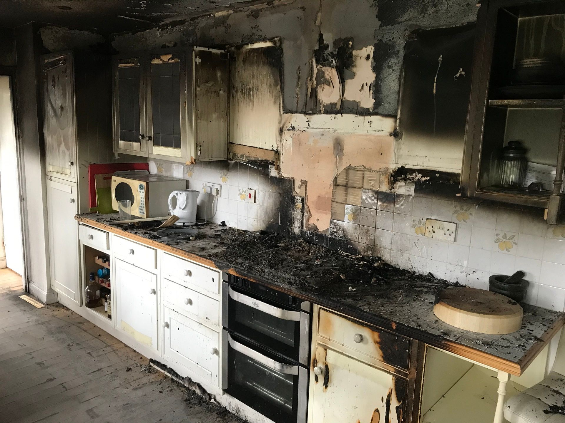 Smoke damage visible in kitchen after fire.
